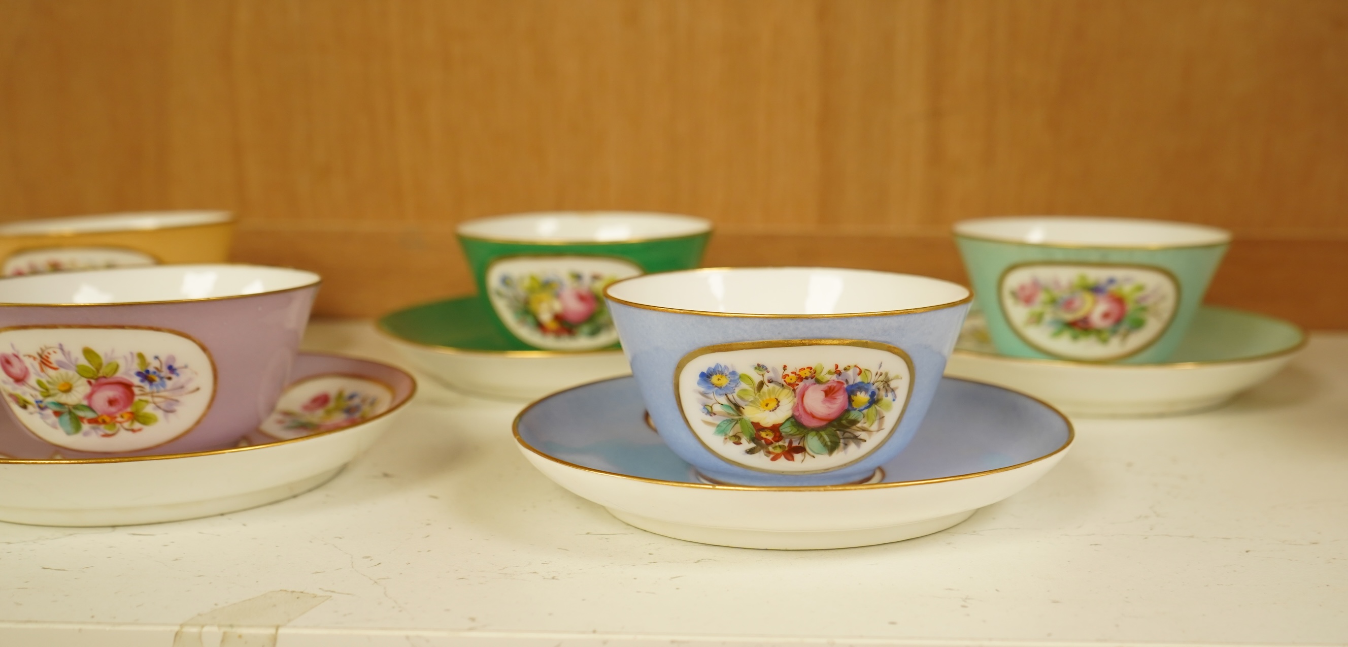 A Sevres style harlequin tea service for six, each saucer 13cm in diameter